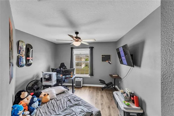 a bedroom with furniture and a bed