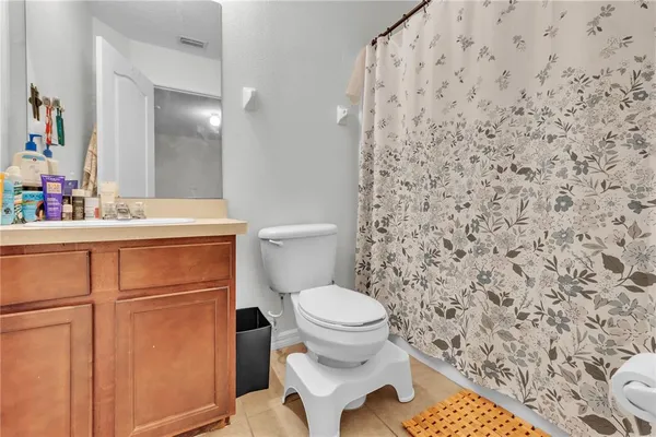 a bathroom with a toilet and a sink