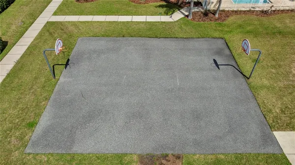 a view of a swimming pool with a yard