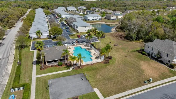 an aerial view of residential houses with outdoor space