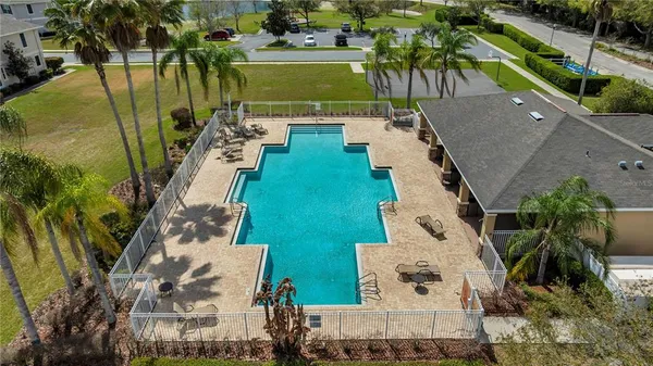 an aerial view of a residential houses with outdoor space