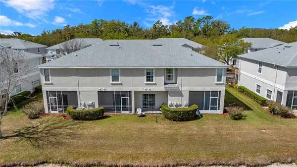 a front view of a house with a yard table and chairs