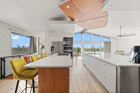 a dining room with furniture and wooden floor