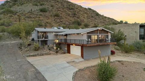 a front view of house with yard outdoor seating and barbeque oven