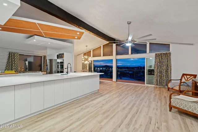 a view of living room and kitchen with furniture