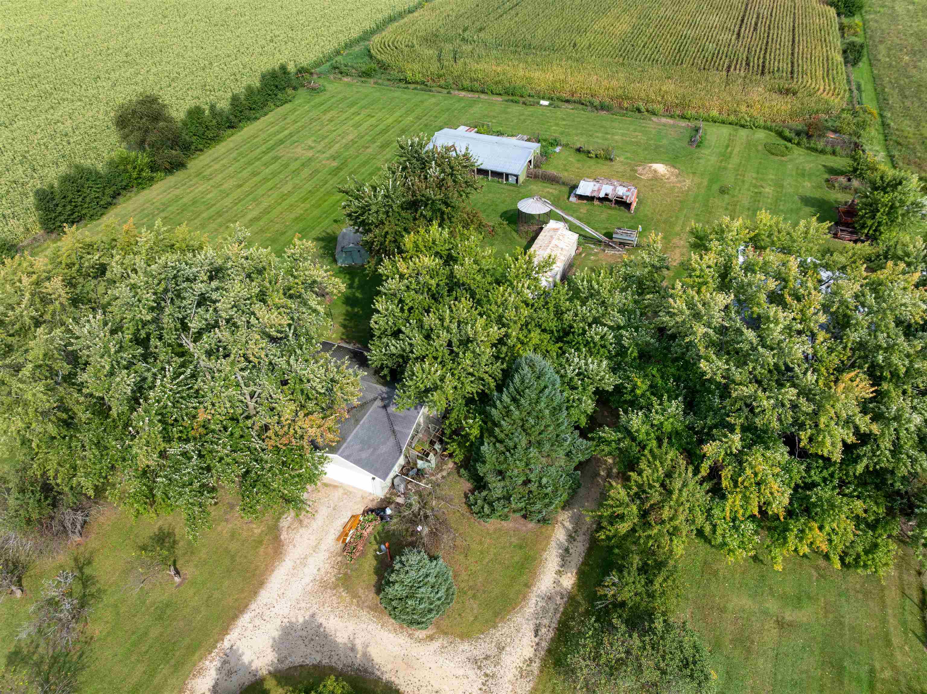 11754 Wange Road Capron, IL 61012 - Photo 19 of 19 a aerial view of a house with a yard and lake view