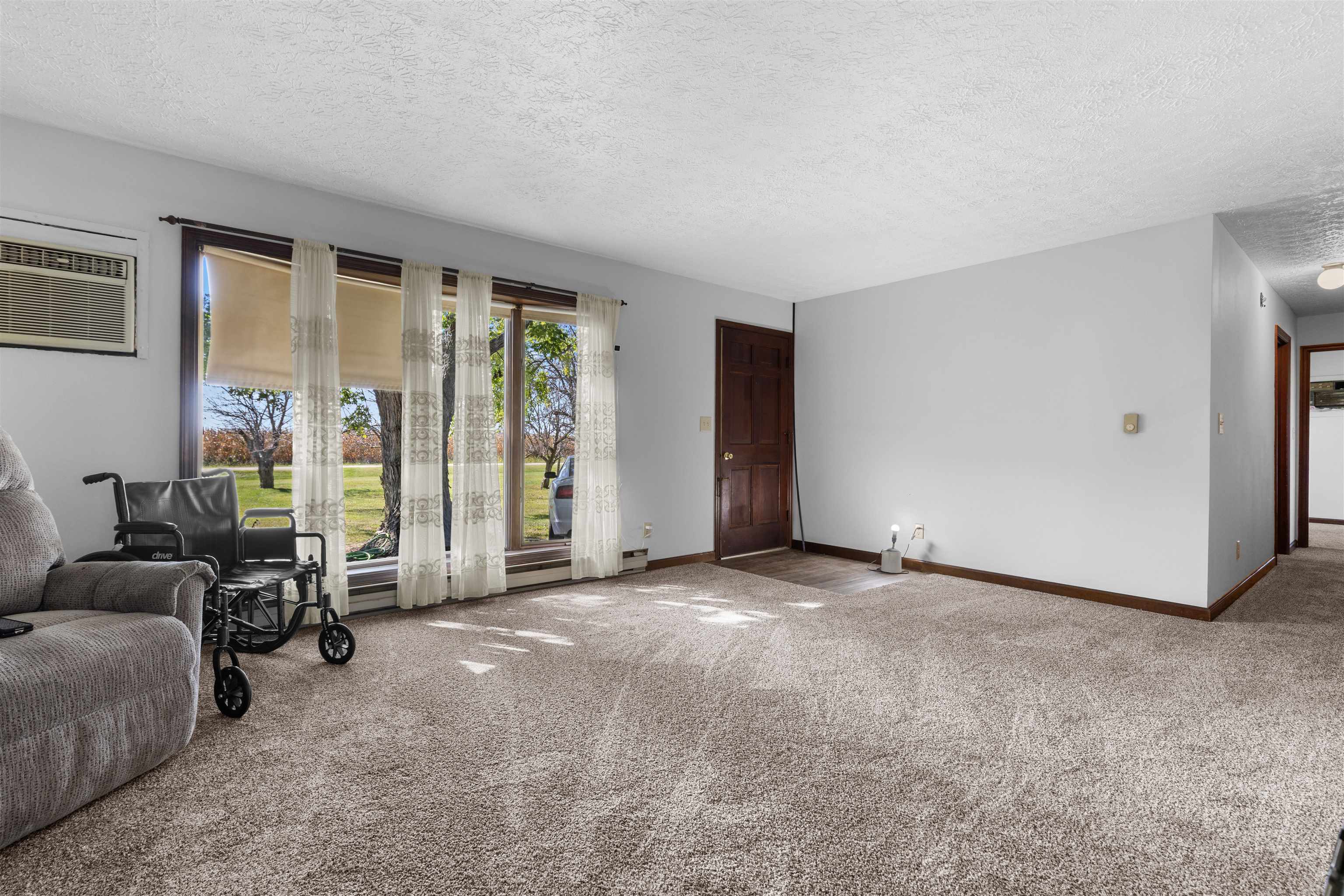 11754 Wange Road Capron, IL 61012 - Photo 5 of 19 a view of a livingroom with a couch and a large window