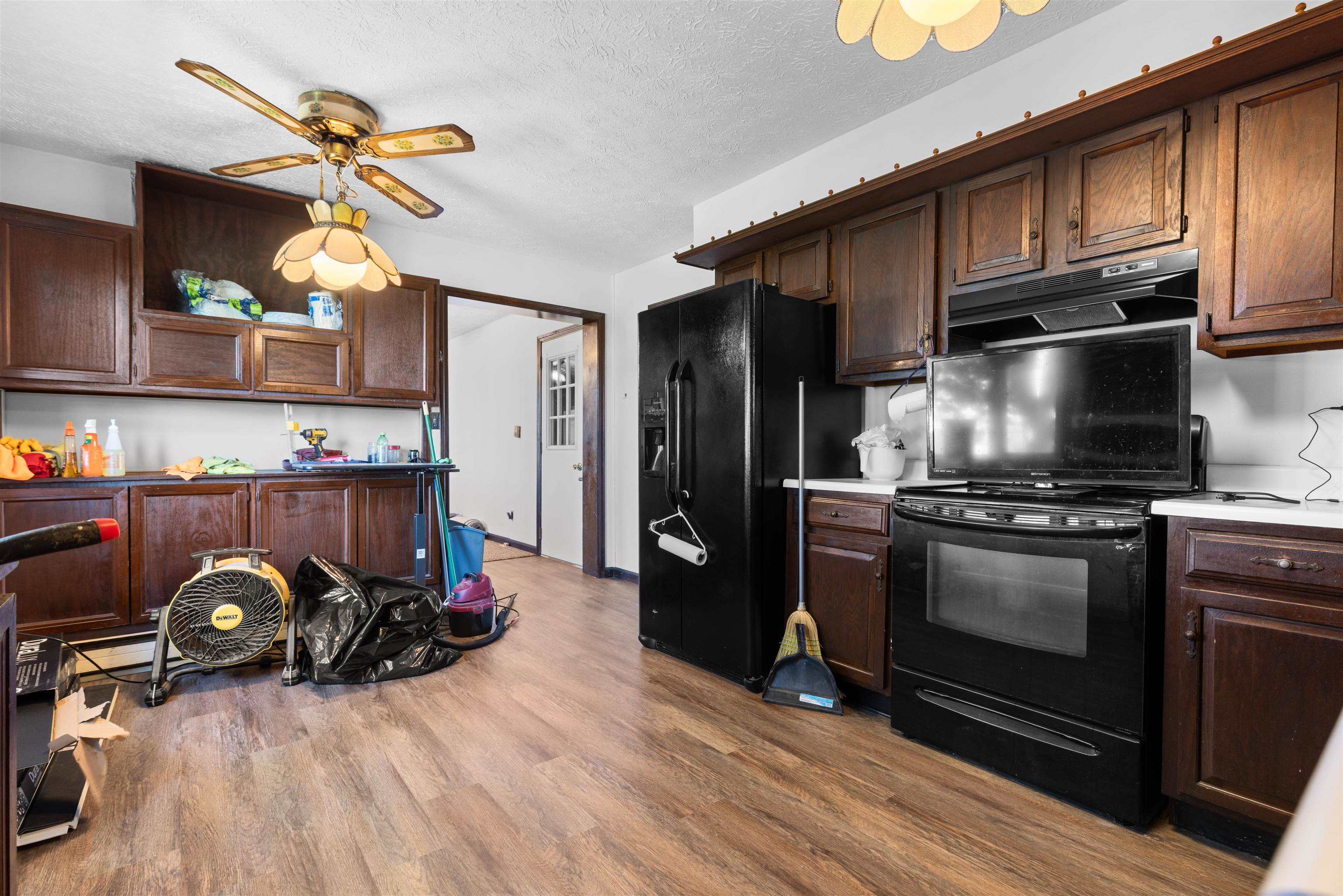 11754 Wange Road Capron, IL 61012 - Photo 7 of 19 a kitchen with granite countertop a stove and a refrigerator