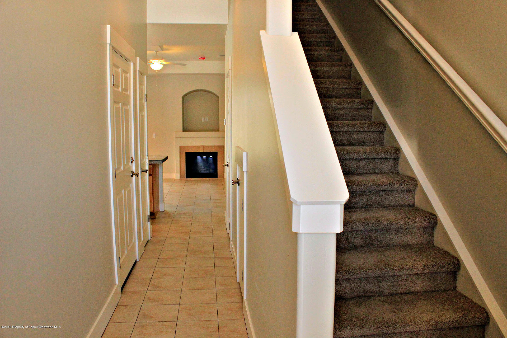656 West 24th Street Rifle, CO 81650 - Photo 2 of 25 1. Entry Hall with Tile & Stairs on the
