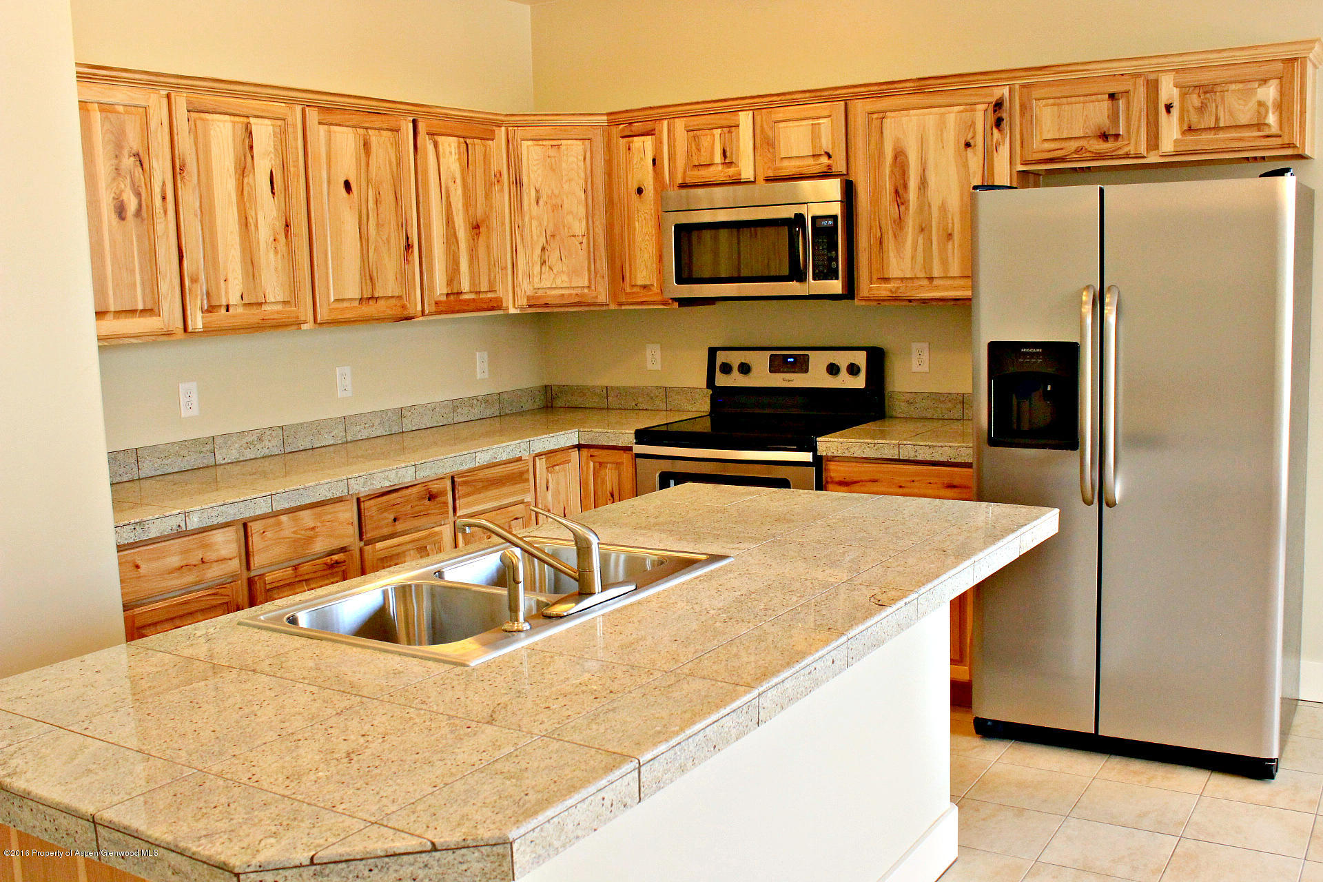 656 West 24th Street Rifle, CO 81650 - Photo 3 of 25 2. Empty Left-Side Kitchen with Stainles