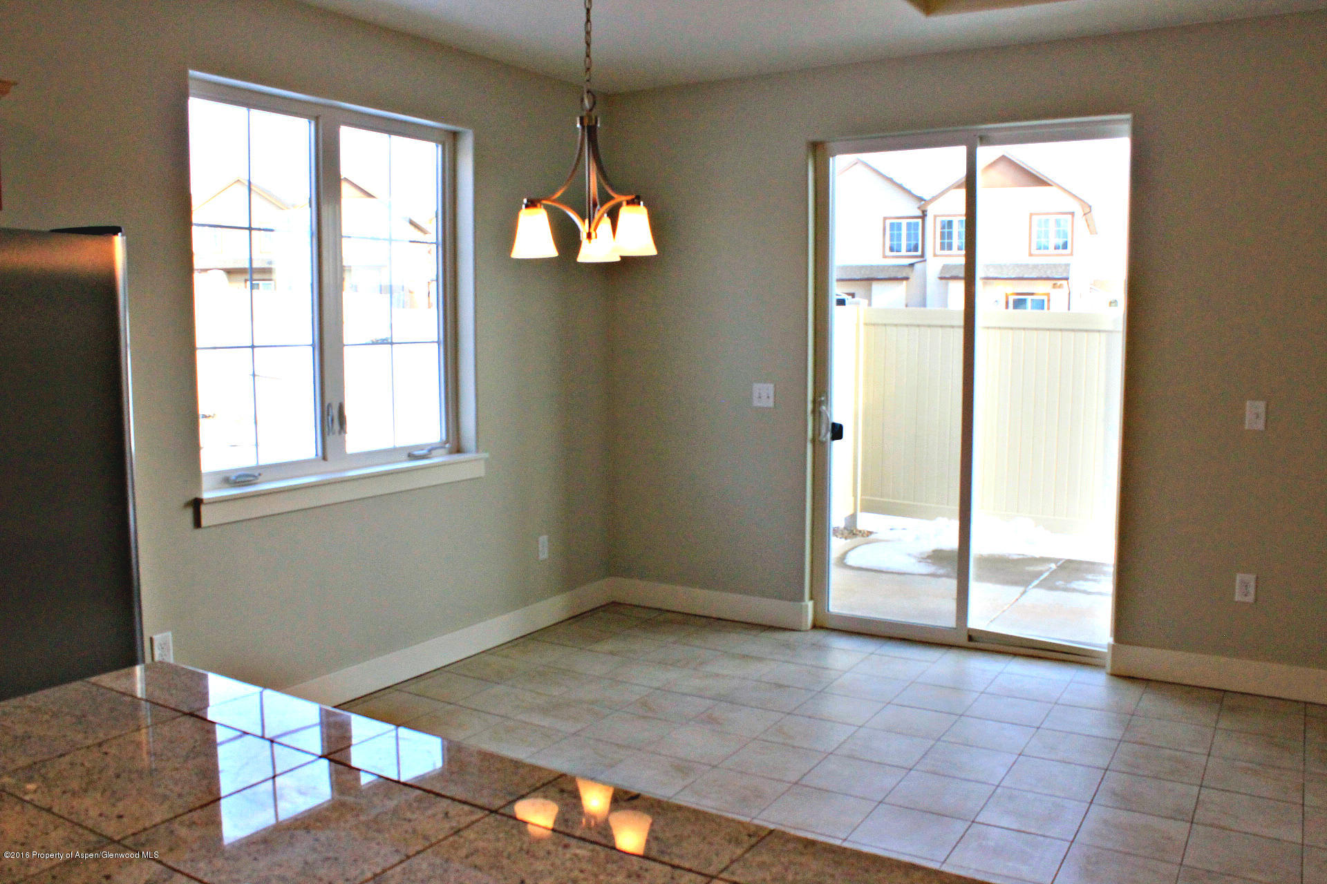 656 West 24th Street Rifle, CO 81650 - Photo 5 of 25 4. Empty Left-Side Dining Room with Tile
