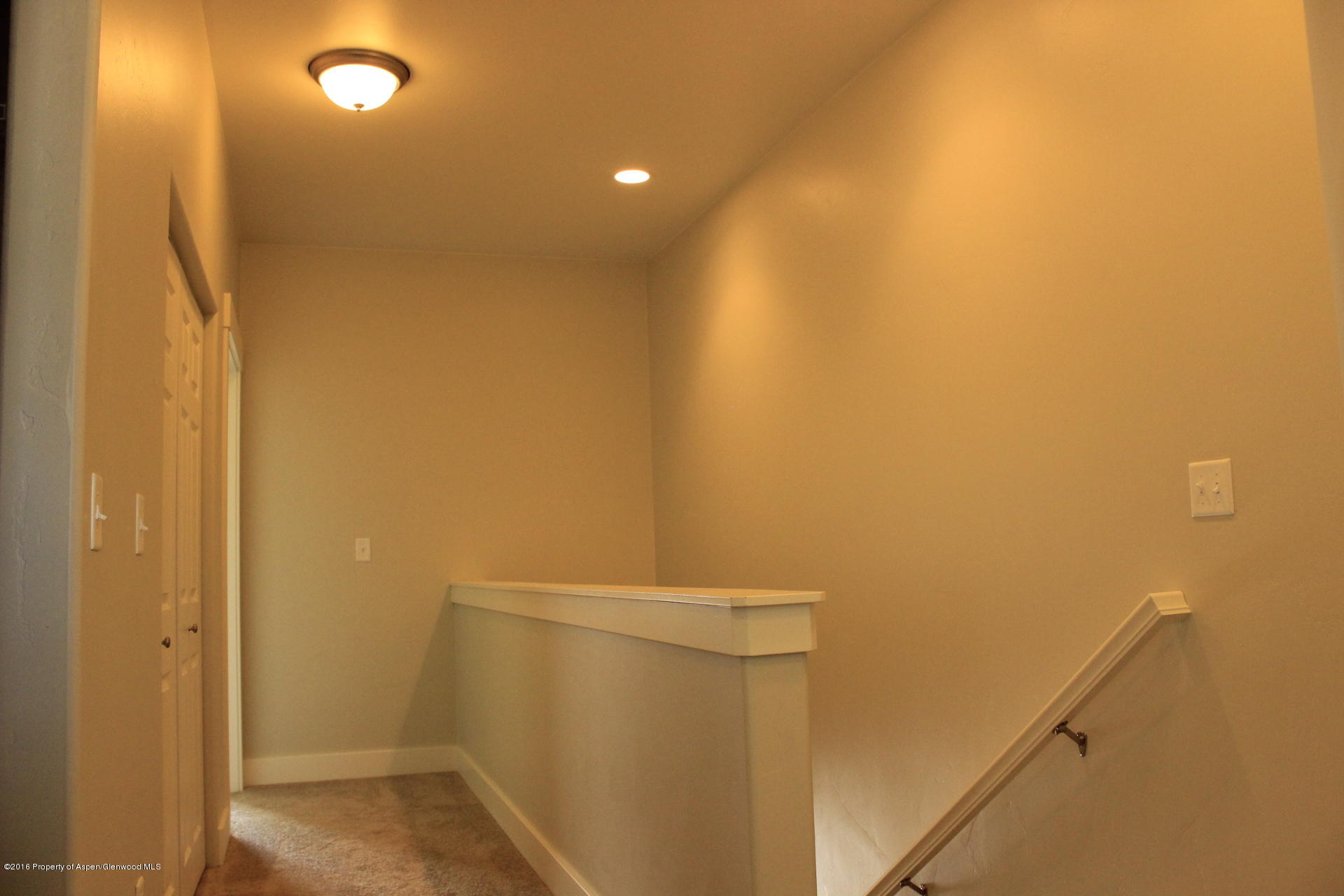 656 West 24th Street Rifle, CO 81650 - Photo 10 of 25 9. Upstairs Hallway with Stairs on the R