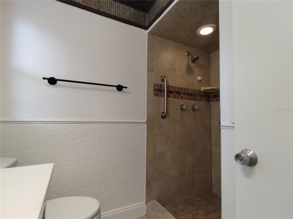 516 Ellsworth Street Altamonte Springs, FL 32701 - Photo 19 of 30 a bathroom with a shower and toilet