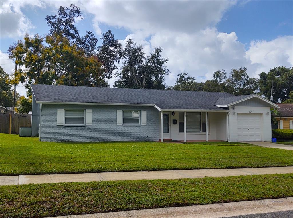 516 Ellsworth Street Altamonte Springs, FL 32701 - Photo 26 of 30 a front view of a house with a garden