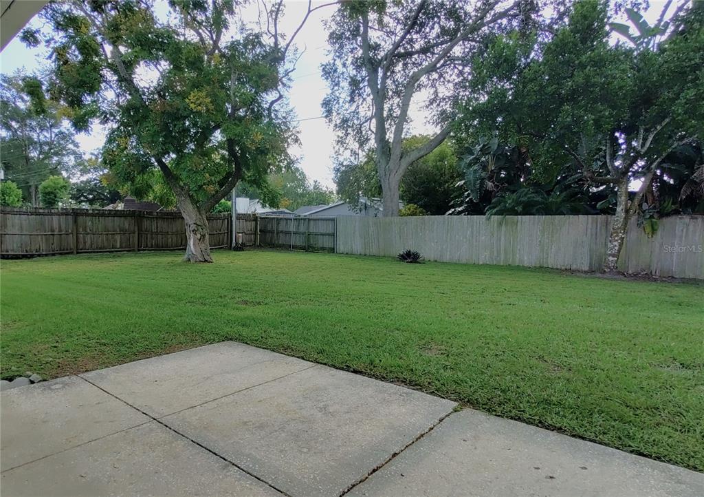516 Ellsworth Street Altamonte Springs, FL 32701 - Photo 27 of 30 a view of a backyard with a small cabin