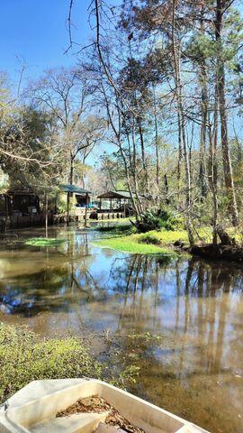 186 Stillwater Road Freeport, FL 32439 - Photo 2 of 8 a view of swimming pool with a yard and outdoor seating
