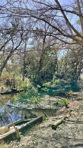 186 Stillwater Road Freeport, FL 32439 - Photo 4 of 8 a view of a yard with plants