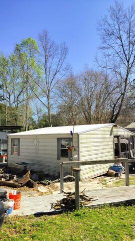 186 Stillwater Road Freeport, FL 32439 - Photo 7 of 8 a view of a house with snow on the wall