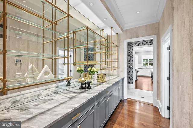 a living room filled with furniture and a large window