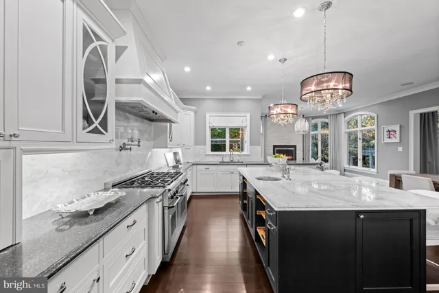 an open kitchen with a table and chairs