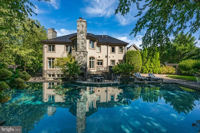 a front view of a house with a lake view