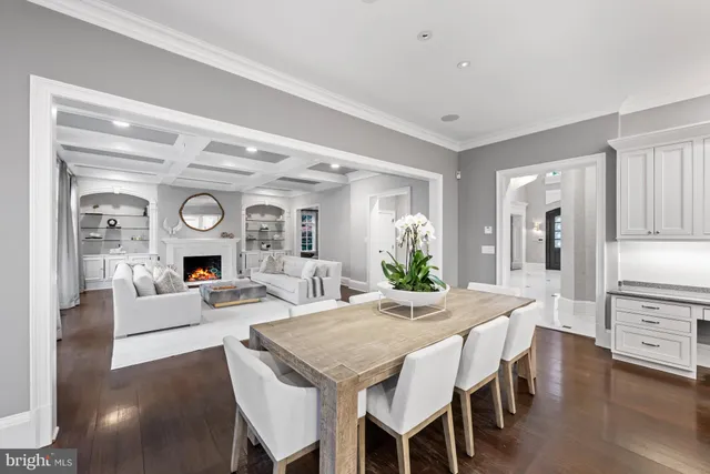 a living room with furniture large window and fireplace