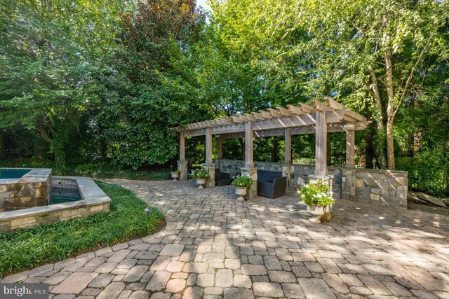 a view of a chair and tables in the backyard of the house