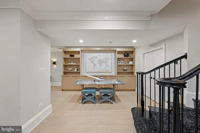 a living room with lots of furniture and kitchen view