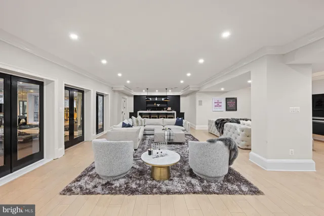 a spacious bedroom with a large bed and a flat screen tv