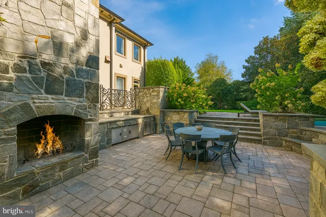 a view of a patio with a table and chairs