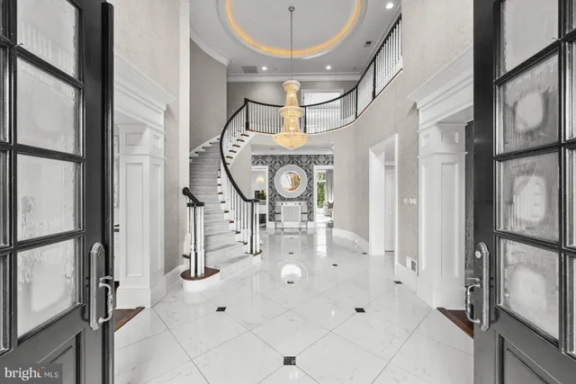 a living room with a mirror and a table