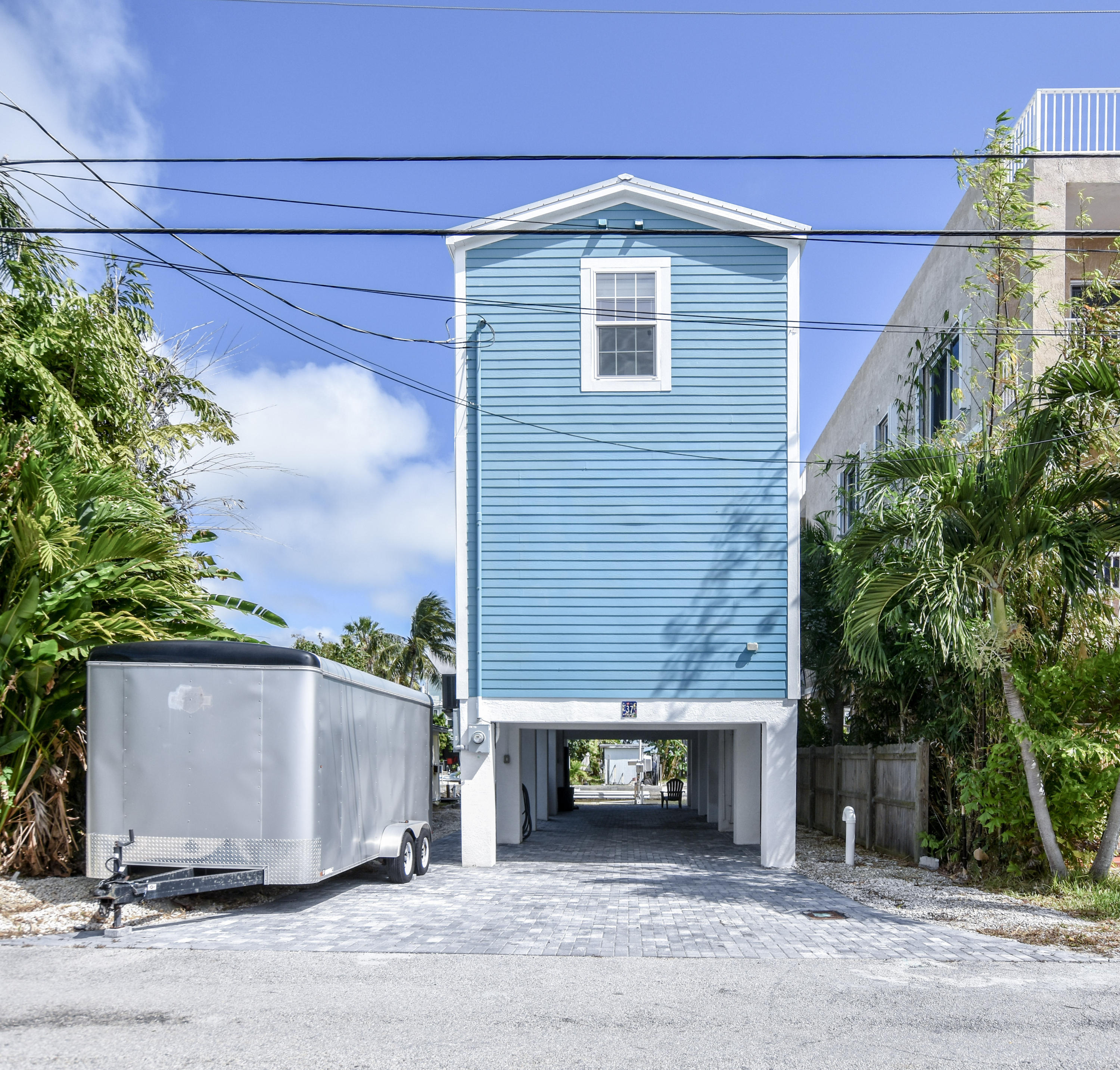 37 Palm Drive Key West, FL 33040 - Photo 1 of 24 a front view of a house with a yard