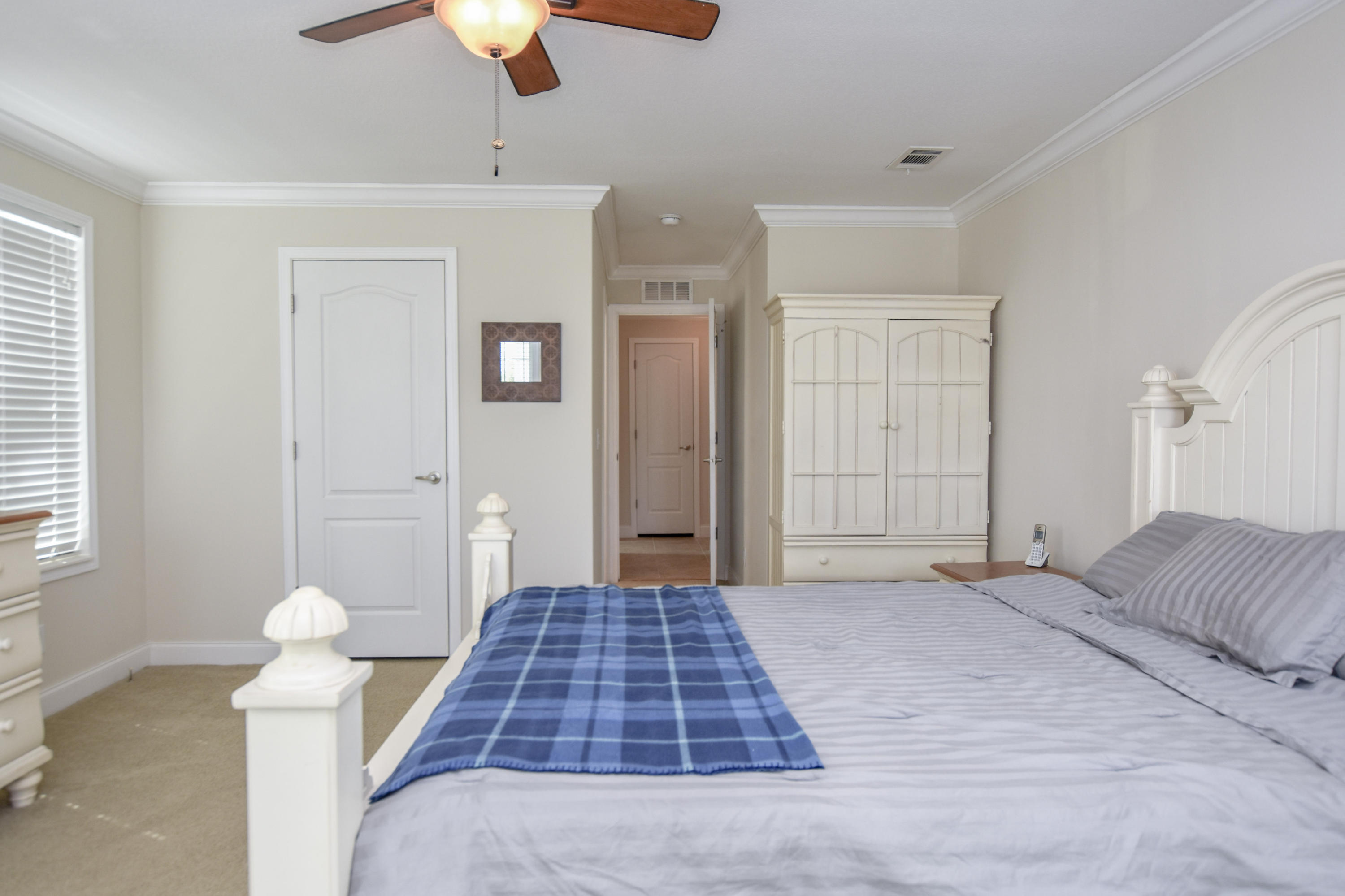 37 Palm Drive Key West, FL 33040 - Photo 14 of 24 a bedroom with a bed and a chandelier