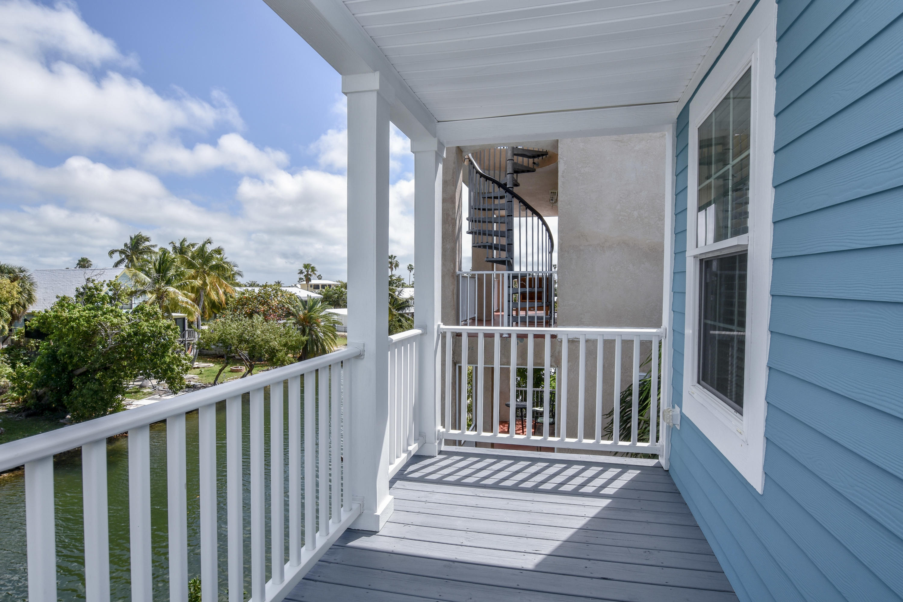 37 Palm Drive Key West, FL 33040 - Photo 15 of 24 a view of a balcony with wooden floor