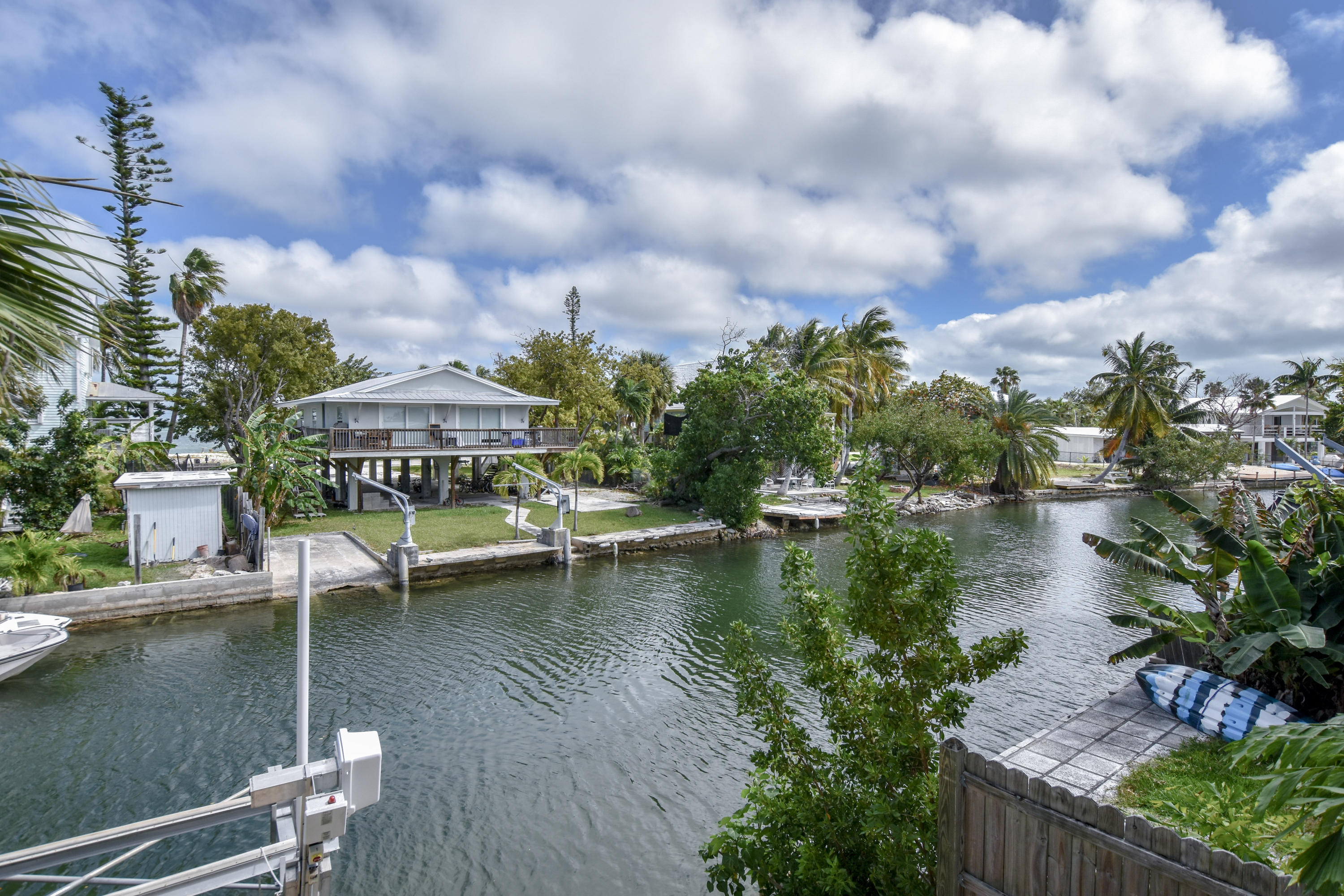 37 Palm Drive Key West, FL 33040 - Photo 16 of 24 a view of a lake with a house in the background