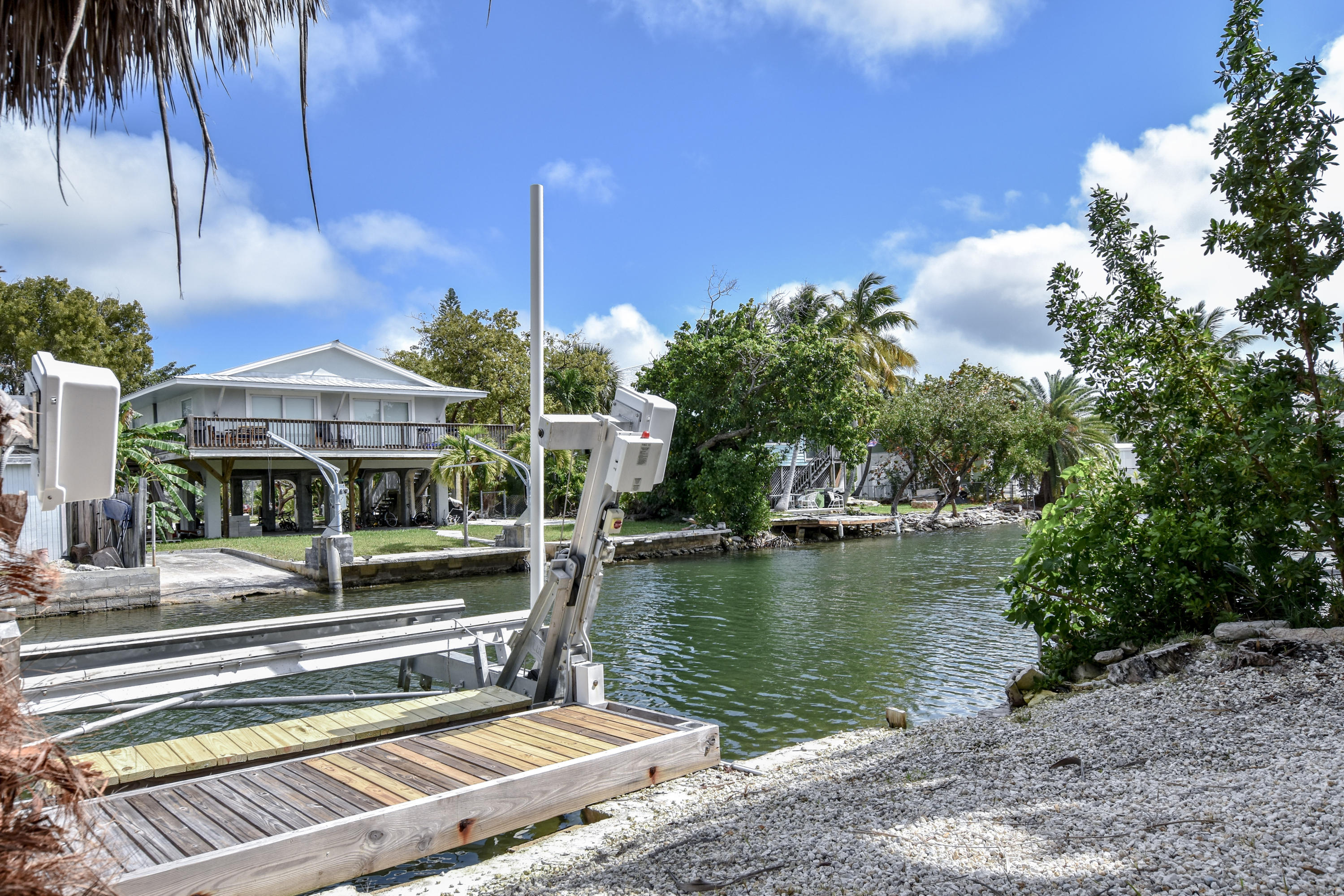 37 Palm Drive Key West, FL 33040 - Photo 22 of 24 a front view of a house with a yard