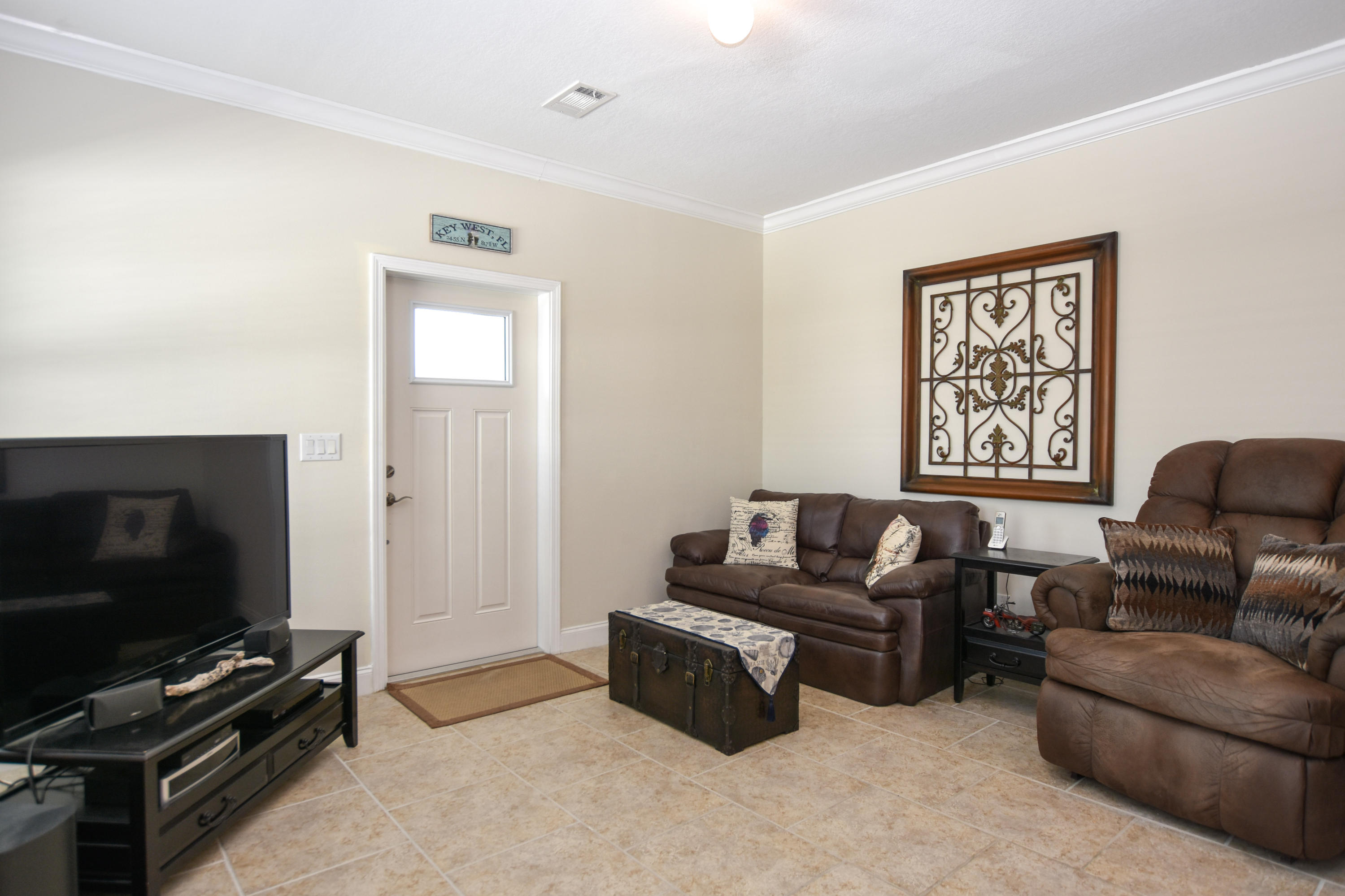 37 Palm Drive Key West, FL 33040 - Photo 2 of 24 a living room with furniture and a flat screen tv