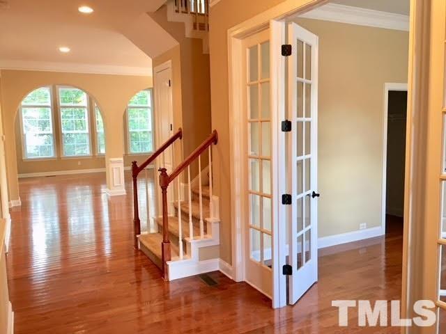 8505 Stonechase Drive Raleigh, NC 27613 - Photo 2 of 24 a view of entryway with wooden floor and windows