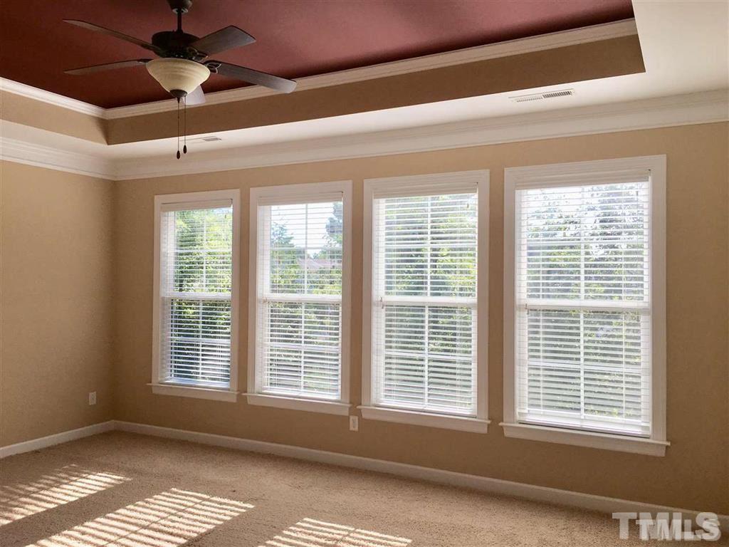 8505 Stonechase Drive Raleigh, NC 27613 - Photo 13 of 24 a view of an empty room with a window