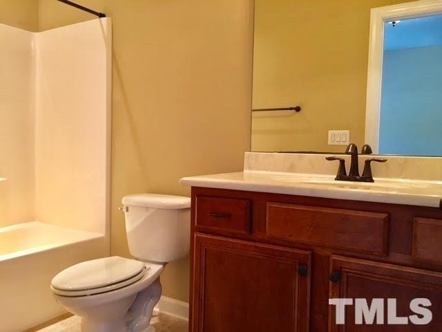 8505 Stonechase Drive Raleigh, NC 27613 - Photo 19 of 24 a bathroom with a sink and a toilet