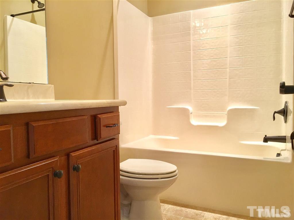 8505 Stonechase Drive Raleigh, NC 27613 - Photo 20 of 24 a bathroom with a sink a toilet and shower