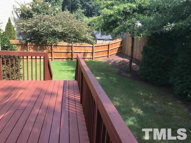 8505 Stonechase Drive Raleigh, NC 27613 - Photo 24 of 24 a balcony with wooden floor and lake view