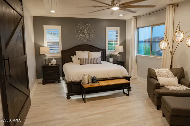 a bedroom with a bed and window