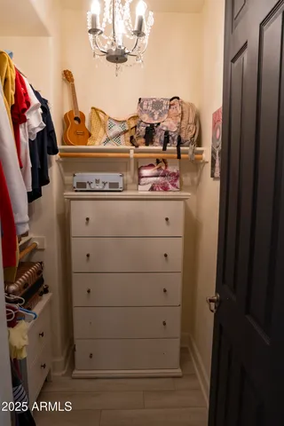 a bathroom with a granite countertop sink vanity and mirror