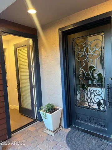 a view of door and chair in a room