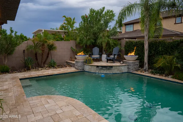 a view of a swimming pool with a patio
