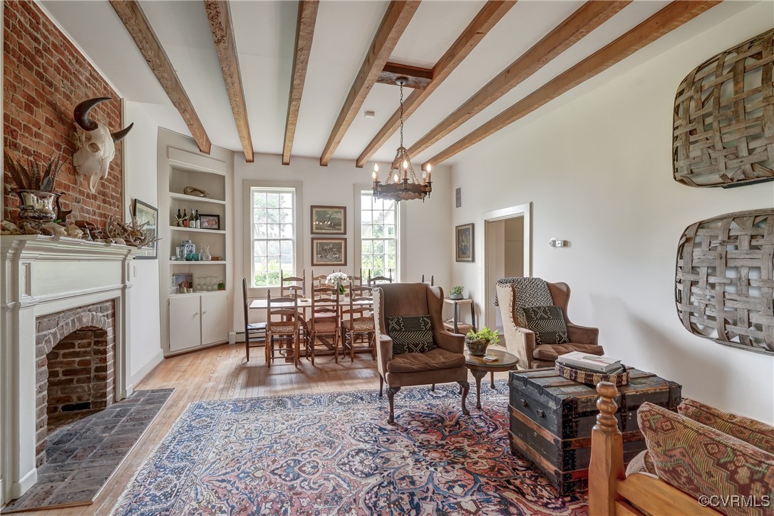 23390 Mt Cloud Road Bowling Green, VA 22427 - Photo 14 of 50 a living room with furniture flat screen tv and a fireplace