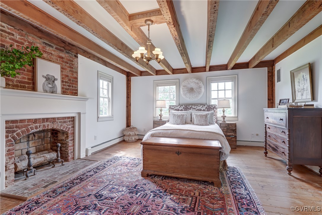 23390 Mt Cloud Road Bowling Green, VA 22427 - Photo 22 of 50 a spacious bedroom with a large bed and a fireplace