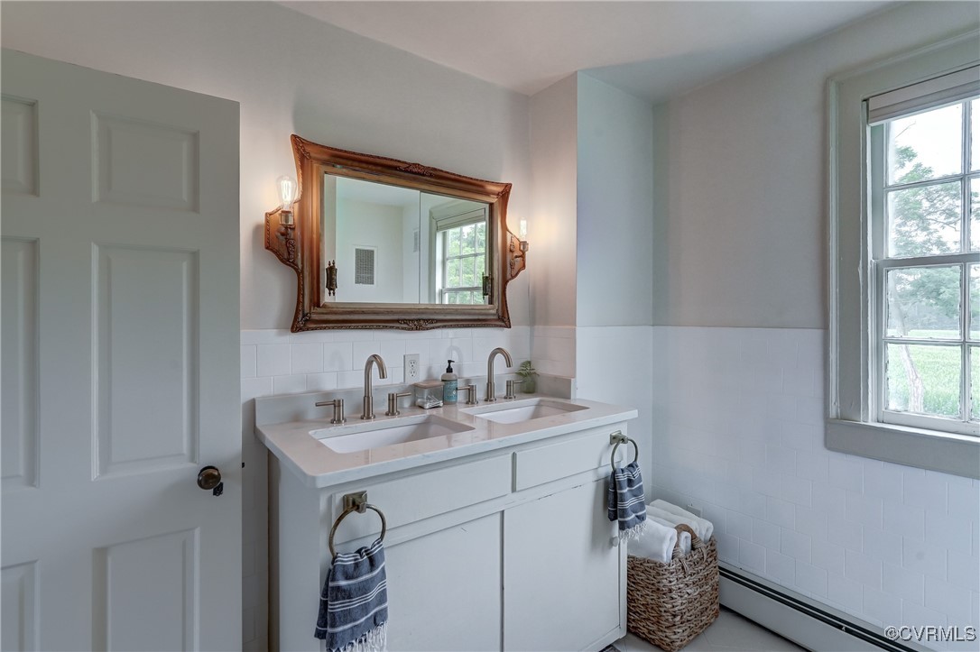 23390 Mt Cloud Road Bowling Green, VA 22427 - Photo 27 of 50 a bathroom with a sink mirror and vanity