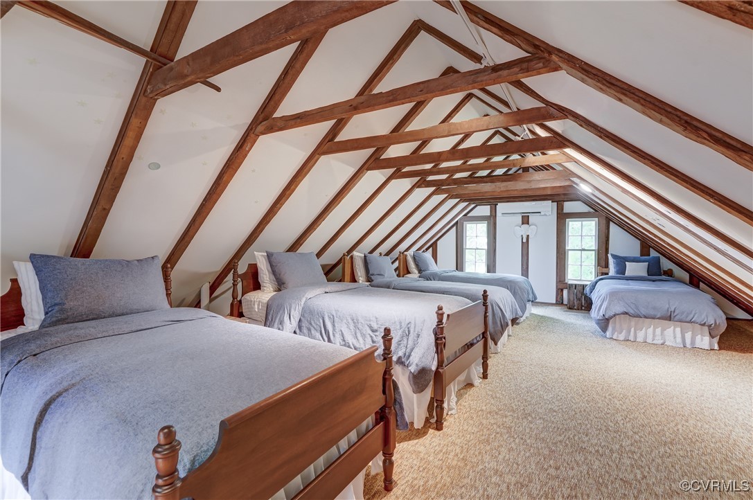 23390 Mt Cloud Road Bowling Green, VA 22427 - Photo 28 of 50 a bedroom with a bed and a chandelier